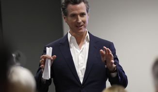 FILE - In this May 25, 2018, file photo, California gubernatorial candidate Lt. Gov. Gavin Newsom speaks during a visit with veterans and their families in San Diego. The heat for California governor is especially intense for Republican Cox and Democrat Antonio Villaraigosa, whom polls show to be in a tough fight for the second of two slots on the general election ballot. Democrat Gavin Newsom is the undisputed front-runner and is expected to advance. The primary is Tuesday, June 5, 2018, and more than 1.4 million ballots have already been cast by mail.  (AP Photo/Gregory Bull, File)