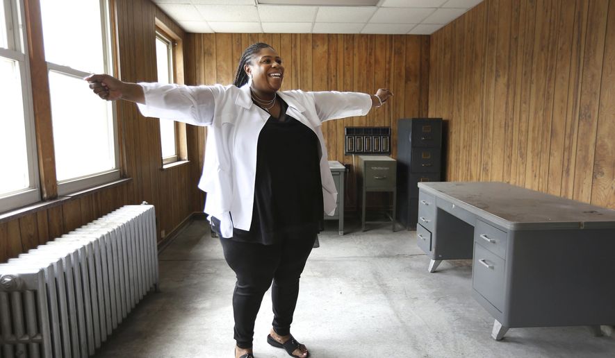 Samaria Rice expresses her joy about her plans to open a cultural center in honor of her son Tamir Rice who was killed by police in 2014. In this light-filled room on the second floor, she will create her office space. Samaria Rice purchased the building in the St. Clair Avenue neighborhood for the future arts and mentoring safe place for kids that she will name the Tamir Rice Afrocentric Cultural Center. (Lisa DeJong/The Plain Dealer via AP)