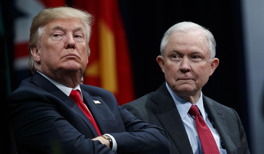President Donald Trump sits with Attorney General Jeff Sessions during the FBI National Academy graduation ceremony in Quantico, Va., on Dec. 15, 2017. (Associated Press) **FILE**