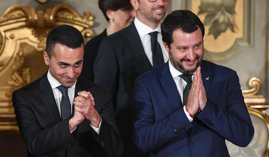 Leader of the League party, Matteo Salvini, right, and Luigi Di Maio, leader of the Five-Star movement, during the swearing-in ceremony for Italy&#39;s new government at Rome&#39;s Quirinale Presidential Palace, Friday, June 1, 2018. (Alessandro Di Meo/ANSA via AP)