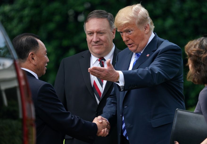 President Donald Trump shakes hands with Kim Yong Chol, left, former North Korean military intelligence chief and one of leader Kim Jong Un&#39;s closest aides, after their meeting in the Oval Office of the White House in Washington, Friday, June 1, 2018, as Secretary of State Mike Pompeo listens at center. (AP Photo/Andrew Harnik)