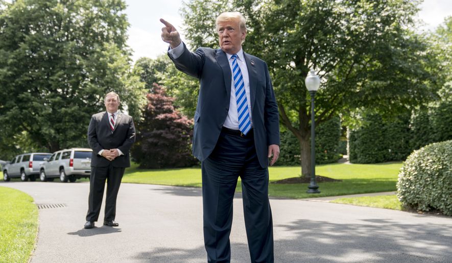 President Donald Trump, center, accompanied by Secretary of State Mike Pompeo, left, speaks to members of the media on the South Lawn outside the Oval Office in Washington, Friday, June 1, 2018, after meeting with former North Korean military intelligence chief Kim Yong-chol. After the meeting Trump announced that the Summit with North Korea will go forward. (AP Photo/Andrew Harnik)