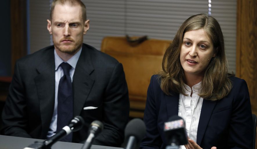 Rita Bettis, right, American Civil Liberties Union of Iowa Legal Director, speaks during a news conference as Emma Goldman Clinic attorney Sam Jones, left, looks on, Friday, June 1, 2018, in Des Moines, Iowa. A judge says he'll temporarily block the most restrictive abortion law in the country from taking effect in Iowa next month. The decision comes under an agreement between lawyers for the state and abortion rights groups that filed a lawsuit challenging the law. (AP Photo/Charlie Neibergall)