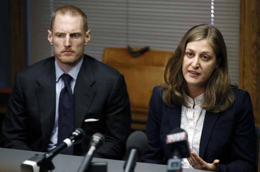 Rita Bettis, right, American Civil Liberties Union of Iowa Legal Director, speaks during a news conference as Emma Goldman Clinic attorney Sam Jones, left, looks on, Friday, June 1, 2018, in Des Moines, Iowa. A judge says he'll temporarily block the most restrictive abortion law in the country from taking effect in Iowa next month. The decision comes under an agreement between lawyers for the state and abortion rights groups that filed a lawsuit challenging the law. (AP Photo/Charlie Neibergall)