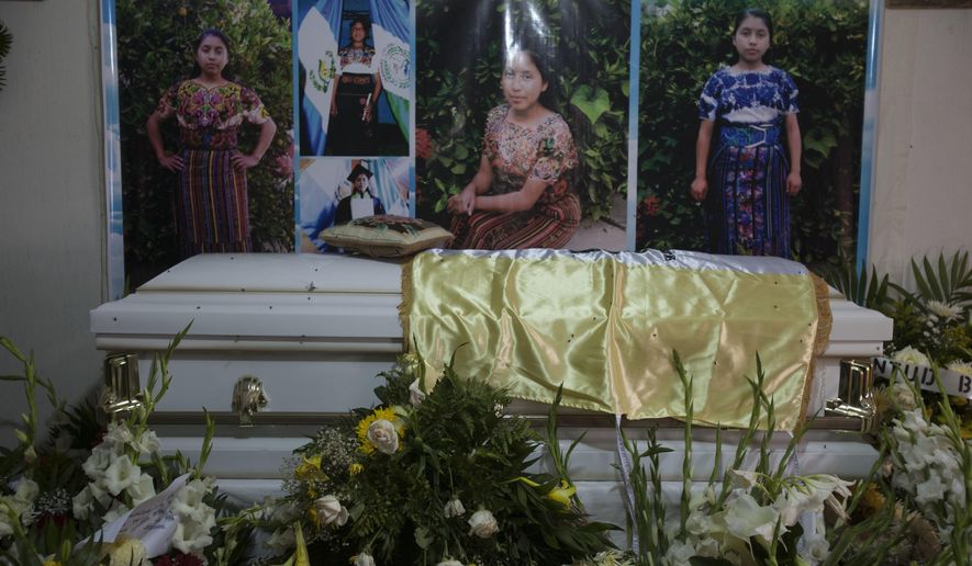 The coffin with the remains of 19-year-old Guatemalan immigrant Claudia Gomez Gonzalez stands at her relatives house during the second day of her wake, in San Juan Ostuncalco, Guatemala, Friday, June 1, 2018. The young woman, who was fatally shot by a U.S. Border Patrol agent in Texas on May 23, had graduated as a forensic accountant but was unable to attend college or find a job, so she had left Guatemala for the U.S., according to her aunt. (AP Photo/Moises Castillo)