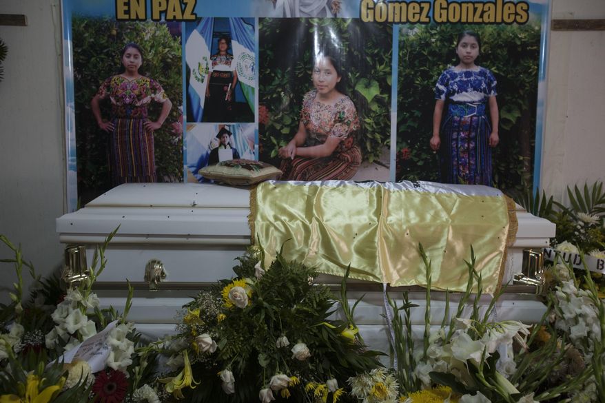 The coffin with the remains of 19-year-old Guatemalan immigrant Claudia Gomez Gonzalez stands at her relatives house during the second day of her wake, in San Juan Ostuncalco, Guatemala, Friday, June 1, 2018. The young woman, who was fatally shot by a U.S. Border Patrol agent in Texas on May 23, had graduated as a forensic accountant but was unable to attend college or find a job, so she had left Guatemala for the U.S., according to her aunt. (AP Photo/Moises Castillo)