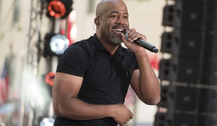 FILE - In this May 25, 2018 file photo, Darius Rucker performs on NBC's Today show at Rockefeller Plaza in New York. Country singers Rucker and Kane Brown are sharing a chart record as the first two solo acts who are also minorities to follow each other with No. 1 country songs in the 28-year history of the Billboard Country Airplay chart.  (Photo by Charles Sykes/Invision/AP, File)