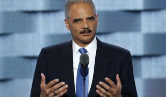 FILE - In this July 26, 2016, file photo former Attorney General Eric Holder speaks during the second day of the Democratic National Convention in Philadelphia. Holder is criticizing President Donald Trump’s use of pardons. Holder, a Democrat who is considering a bid for the White House, spoke in New Hampshire Friday, a day after Trump pardoned conservative author and filmmaker Dinesh D’Souza. D’Souza was sentenced to five years’ probation for illegal campaign contributions. (AP Photo/J. Scott Applewhite, File)