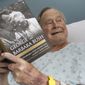 This photo provided by Office of George H. W. Bush shows a photo of former President George H.W. Bush that has tweeted on Friday, June 1, 2018 from his hospital bed while reading a book about himself and his late wife in Biddeford, Maine. The 41st president is 93 and is recovering in a Maine hospital after experiencing low blood pressure and fatigue.   Barbara Bush died in April at age 92. She was married to the former president for 73 years..(Paul Morse/Office of George H. W. Bush via AP)