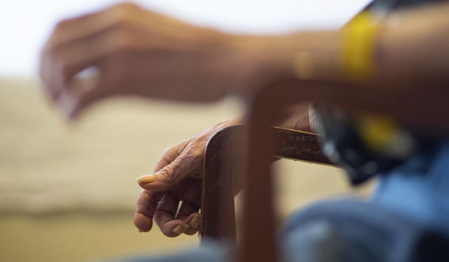 In this Tuesday, May 22, 2018 photo, Bob Davis, 78, is photographed in a Yakima Neighborhood Health Services respite unit in Yakima, Wash. Davis suffers from dementia and has been shuffled between different service providers, the hospital and police before finally ending up in the care of Yakima Neighborhood Health Services. (Shawn Gust/Yakima Herald-Republic via AP)