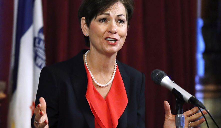 FILE - In this May 25, 2017, file photo, Iowa Gov. Kim Reynolds speaks during a news conference at the Statehouse in Des Moines, Iowa. Reynolds signed into law Wednesday, May 30, 2018, state tax cuts of $2.8 billion over six years, touting the benefits for the middle class. Most changes in personal income tax rates go into effect in tax year 2019, including lower rates for all income brackets. (AP Photo/Charlie Neibergall, File)