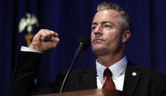 FILE - In this Saturday, May 5, 2018 file photo, California gubernatorial candidate Travis Allen, a Republican Assemblyman from Huntington Beach, Calif., speaks during the California Republican Party convention in San Diego. Tuesday&#39;s primary election will set the stage for November races for governor, Congress and the Legislature, but it will also test whether the state&#39;s vanishing Republicans have enough remaining influence to avoid another shutout at the statewide polls.(AP Photo/Gregory Bull,File)