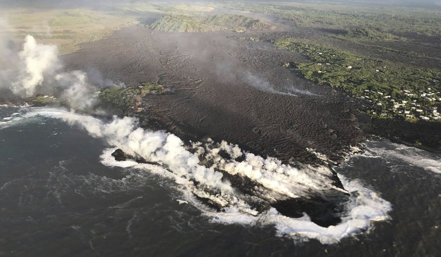 This photo provided by U.S. Geological Survey shows an aerial  view of ocean entry at Kapoho Bay, Hawaii on Tuesday,  June 5, 2018.  Lava destroyed hundreds of homes in mostly rural Hawaii area overnight, a county spokeswoman said Tuesday. A morning overflight confirmed that lava completely filled Kapoho Bay, inundated most of Vacationland and covered all but the northern part of Kapoho Beach Lots, scientists with the U.S. Geological Survey&#39;s Hawaiian Volcano Observatory said.  (U.S. Geological Survey via AP)