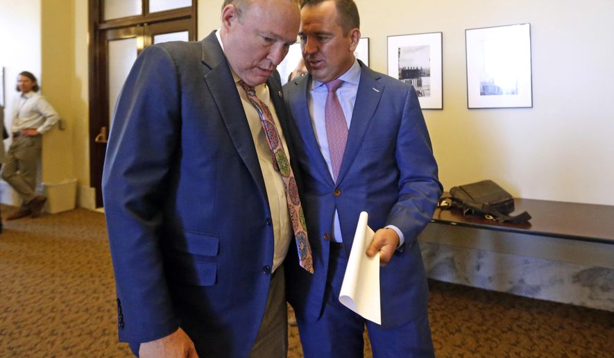 Sen. Jim Dabakis, D-Salt Lake City, left, talks with Utah House Speaker Greg Hughes, R-Draper, before a news conference at the Utah State Capitol Tuesday, June 5, 2018, in Salt Lake City. An unlikely political friendship has spawned a grand compromise proposal on an "enormous" planned shipping hub in Salt Lake City but it remains to be seen it whether it can soothe deep-seated concerns. The plan announced Tuesday would give the city more control over tax revenue as well as environment and zoning around the inland port facility, where cargo from West Coast seaports would transferred to trucks and railcars. (AP Photo/Rick Bowmer)