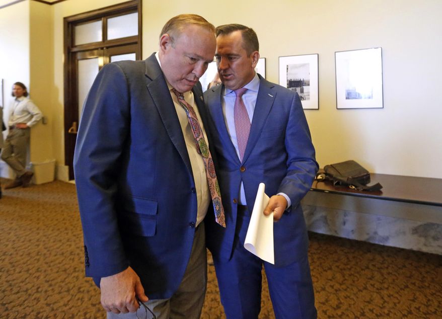 Sen. Jim Dabakis, D-Salt Lake City, left, talks with Utah House Speaker Greg Hughes, R-Draper, before a news conference at the Utah State Capitol Tuesday, June 5, 2018, in Salt Lake City. An unlikely political friendship has spawned a grand compromise proposal on an "enormous" planned shipping hub in Salt Lake City but it remains to be seen it whether it can soothe deep-seated concerns. The plan announced Tuesday would give the city more control over tax revenue as well as environment and zoning around the inland port facility, where cargo from West Coast seaports would transferred to trucks and railcars. (AP Photo/Rick Bowmer)