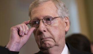 Senate Majority Leader Mitch McConnell, R-Ky., tells reporters he intends to cancel the traditional August recess and keep the Senate in session to deal with backlogged tasks, on Capitol Hill in Washington, Tuesday, June 5, 2018. (AP Photo/J. Scott Applewhite)