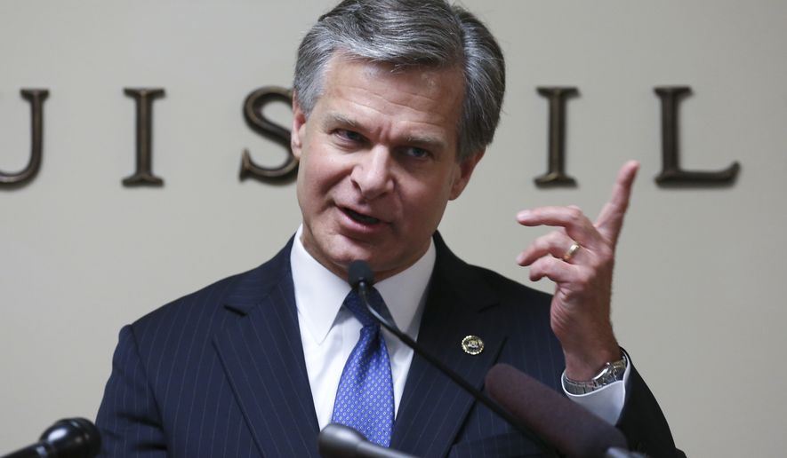 FBI Director Christopher Wray visits the Louisville FBI field office to share remarks and take a few questions, Wednesday, June 6, 2018 in Louisville, Ky. (Sam Upshaw Jr./Courier Journal via AP)