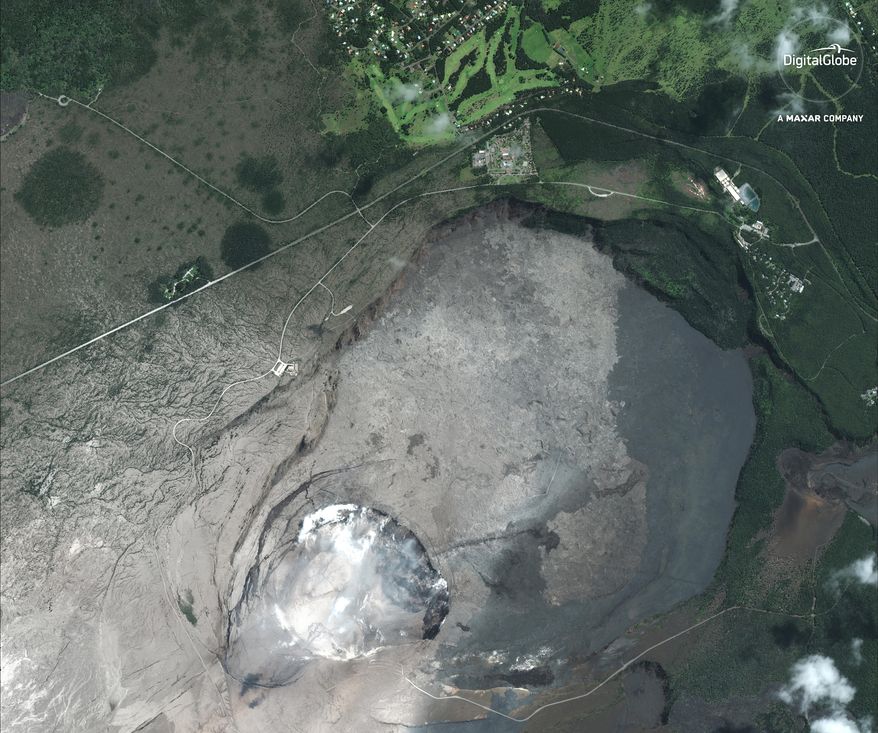 This satellite image provided by Digital Globe captured June 5, 2018, shows Kilauea summit crater in Hawaii. Lava from the Kilauea volcano destroyed hundreds of homes in a mostly rural area on the Big Island of Hawaii overnight. It's the largest number of destroyed homes since the eruption began last month. A spokeswoman for Hawaii County says an exact count of destroyed homes has yet to be determined. (Satellite Image ©2018 DigitalGlobe, a Maxar company via AP)