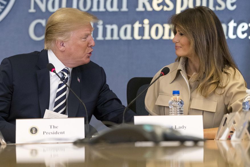 President Donald Trump looks toward first lady Melania Trump at a briefing on this year's hurricane season at the Federal Emergency Management Agency Headquarters, Wednesday, June 6, 2018, in Washington. (AP Photo/Andrew Harnik)