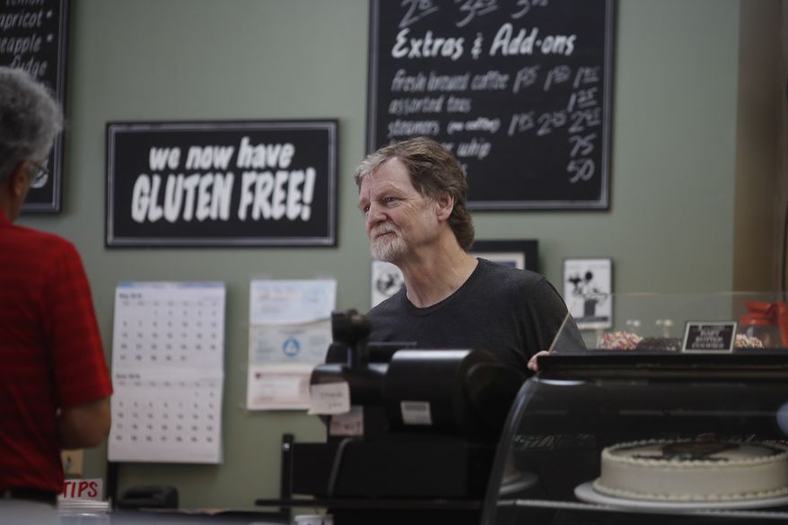 Baker Jack Phillips, owner of Masterpiece Cakeshop, manages his shop after the U.S. Supreme Court ruled that he could refuse to make a wedding cake for a same-sex couple because of his religious beliefs did not violate Colorado&#x27;s anti-discrimination law Monday, June 4, 2018, in Lakewood, Colo. (AP Photo/David Zalubowski)