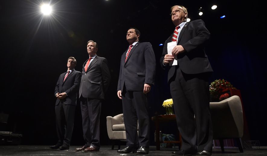Gubernatorial candidates, from left to right, Steve Obsitnik, Ned Lamont, Tim Herbst and Mark Boughton stand on stage during a walk-through prior to a Governor's Forum at the University of Hartford's Lincoln Theater in West Hartford, Conn., Thursday, June 7, 2018. (Brad Horrigan/Hartford Courant via AP)