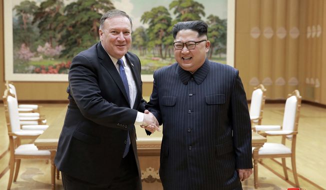 FILE - In this May 9, 2018, file photo provided by the North Korean government, U.S. Secretary of State Mike Pompeo, left, shakes hands with North Korean leader Kim Jong Un during a meeting at Workers&#x27; Party of Korea headquarters in Pyongyang, North Korea. Ahead of a planned summit Tuesday, June 12,  in Singapore between President Donald Trump and North Korean autocrat Kim Jong Un, there has been talk of complete denuclearization, North Korea has shut down (for now) its nuclear test site, and senior U.S. and North Korean officials have shuttled between Pyongyang and Washington for meetings with Kim and Trump. The top U.S. diplomat declared that “Chairman Kim shares the objectives with the American people” amid talk of a grand bargain that could see North Korean disarmament met with a massive influx of outside aid. Korean language watermark on image as provided by source reads: &amp;quot;KCNA&amp;quot; which is the abbreviation for Korean Central News Agency. (Korean Central News Agency/Korea News Service via AP, File)