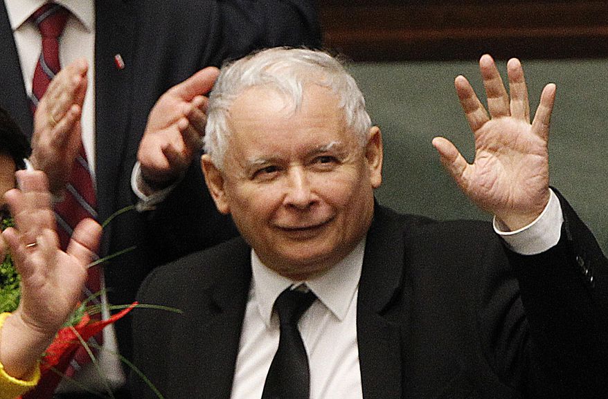FILE - In this Dec. 7, 2017 file photo, Jaroslaw Kaczynski, the powerful leader of Poland's ruling Law and Justice party, waves after the government survived a no-confidence vote at the parliament building in Warsaw, Poland. The head of a Warsaw hospital said Friday June 8, 2018, the leader of Poland's ruling party, Jaroslaw Kaczynski, has been discharged following treatment that has "stabilized his health condition." (AP Photo/Czarek Sokolowski, File)