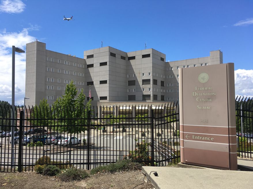 This Friday, June 8, 2018 photo shows the Federal Detention Center in SeaTac, Wash. The Northwest Immigrant Rights Project reported that as many as 120 asylum seekers had been transferred to this facility. Washington state&#39;s governor says six children were brought to a Seattle foster care facility after federal immigration authorities separated them from their families at the border. (AP Photo/Sally Ho)