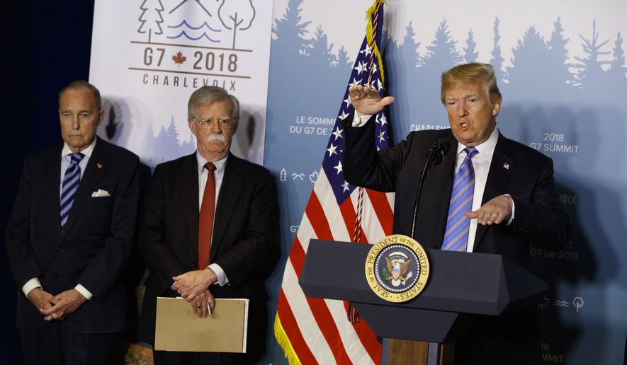 White House chief economic adviser Larry Kudlow, left, and National Security Adviser John Bolton look on as President Donald Trump speaks during a news conference at the G-7 summit, Saturday, June 9, 2018, in La Malbaie, Quebec, Canada.  (AP Photo/Evan Vucci) (AP Photo/Evan Vucci)