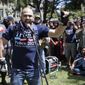In this April 27, 2017, file photo, right wing group Patriot Prayer leader Joey Gibson speaks during a rally in support of free speech in Berkeley, Calif. The conflict between Patriot Prayer and the so-called &amp;quot;antifa&amp;quot; has dominated the landscape at marches and rallies in Portland, Ore., in recent months, creating turmoil and soul-searching in the city, a liberal bastion that also hides a dark and lesser-known history of racism dating back decades. (AP Photo/Marcio Jose Sanchez, file)