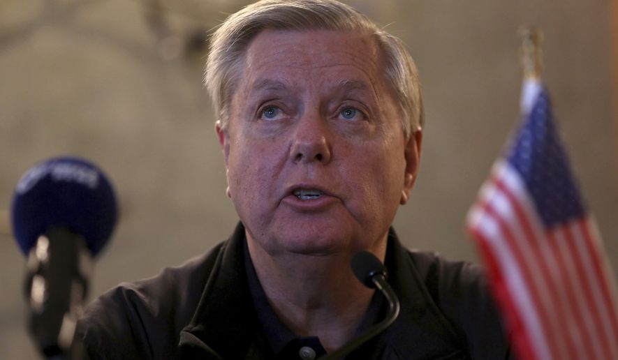 U.S. Senator Lindsey Graham speaks during a press conference with Senator Chris Coons in Amman, Jordan, Monday, Feb. 20, 2018. Graham, the chairman of a U.S. Senate panel dealing with foreign aid said Tuesday that a new agreement granting Jordan $1.275 billion a year through 2022 “is a floor” and that Congress is likely to authorize additional financial support for the kingdom. (AP Photo/Raad Adayleh)