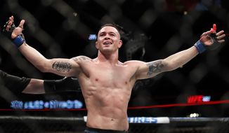 In this file photo, Colby Covington reacts after his win against Rafael Dos Anjos during their interim welterweight UFC 225 mixed martial arts bout Saturday, June 9, 2018, in Chicago. (AP Photo/Jim Young)  **FILE**