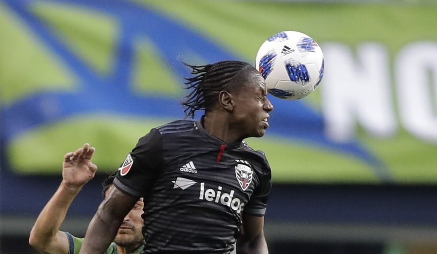 D.C. United forward Darren Mattocks heads the ball against the Seattle Sounders during an MLS soccer match, Saturday, June 9, 2018, in Seattle. The Sounders won 2-1. (AP Photo/Ted S. Warren) ** FILE **