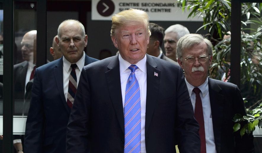 U.S. President Donald Trump leaves the G7 Leaders Summit in La Malbaie, Que., on Saturday, June 9, 2018., with White House Chief of Staff John Kelly, left, and National Security Adviser John Bolton. (Sean Kilpatrick/The Canadian Press via AP)