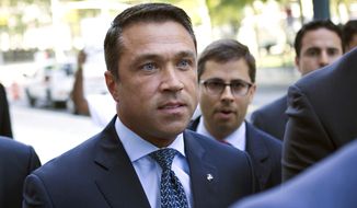 FILE - In this July 17, 2015 file photo, former U.S. Rep. Michael Grimm arrives ahead of his sentencing for aiding in filing a false tax return, at federal court in the Brooklyn borough of New York. On Monday, June 11, 2018, the first debate between the two men running in a no-holds-barred Republican Congressional primary for 11th Congressional District, which covers conservative Staten Island as well as a slice of Brooklyn, was heated and at times hostile. But incumbent Congressman Dan Donovan and Grimm both spoke of their support for President Donald Trump, and getting his agenda accomplished. (AP Photo/Kevin Hagen)
