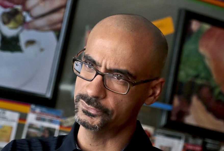 In this Sept. 3, 2013 photo, Pulitzer Prize winning author Junot Diaz pauses during an interview in New York. Three editors at the Boston Review are resigning over the political and literary magazine's decision to retain Diaz despite allegations of sexual misconduct. Poetry editors Timothy Donnelly, Barbara Fischer and Stefania Heim said on Twitter last week they're "dismayed" at the logic behind keeping Diaz as fiction editor and felt compelled to step down, effective July 1. (AP Photo/Bebeto Matthews, File)