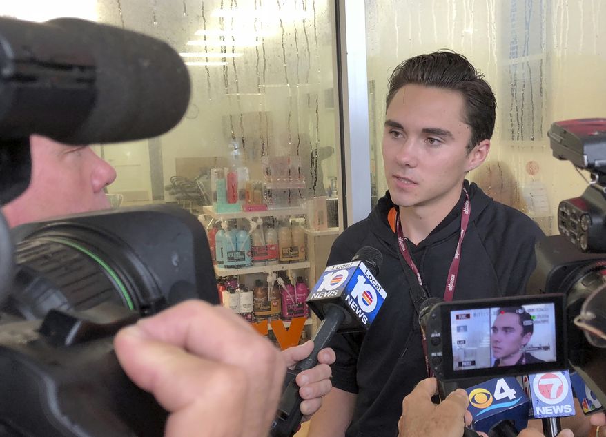 David Hogg, a student at Marjory Stoneman Douglas speaks outside a Publix Supermarket in Coral Springs, Fla., Friday, May 25, 2018. (Associated Press)