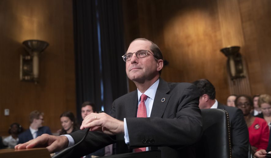 Secretary of Health and Human Services Alex Azar prepares to testify before the Senate Health, Education, Labor, and Pensions Committee at a hearing on prescription drug prices, on Capitol Hill in Washington, Tuesday, June 12, 2018. Before joining the Trump Cabinet, Azar was president of the U.S. division of Eli Lilly and Company, a major pharmaceutical drug company. (AP Photo/J. Scott Applewhite)