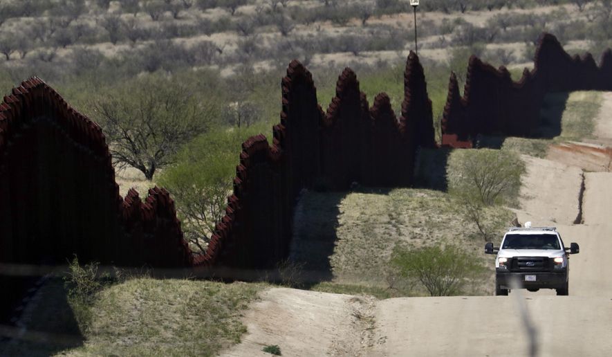 FILE--In this April 10, 2018, file photo, a Customs and Border Patrol agent patrols the international border near Nogales, Ariz. The U.S. Border Patrol says an agent has been wounded in a shooting in southern Arizona near the U.S.-Mexico border. (AP Photo/Matt York, file)