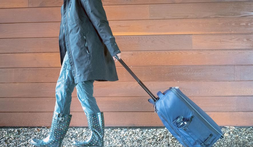 This June 2018 photo provided by VLES shows the company's GO-bag being wheeled. The bag is a best-in-class fully-stocked emergency bag that has things you could need in case of an emergency and has plenty of room for the personal items you'll need. (VLES via AP)