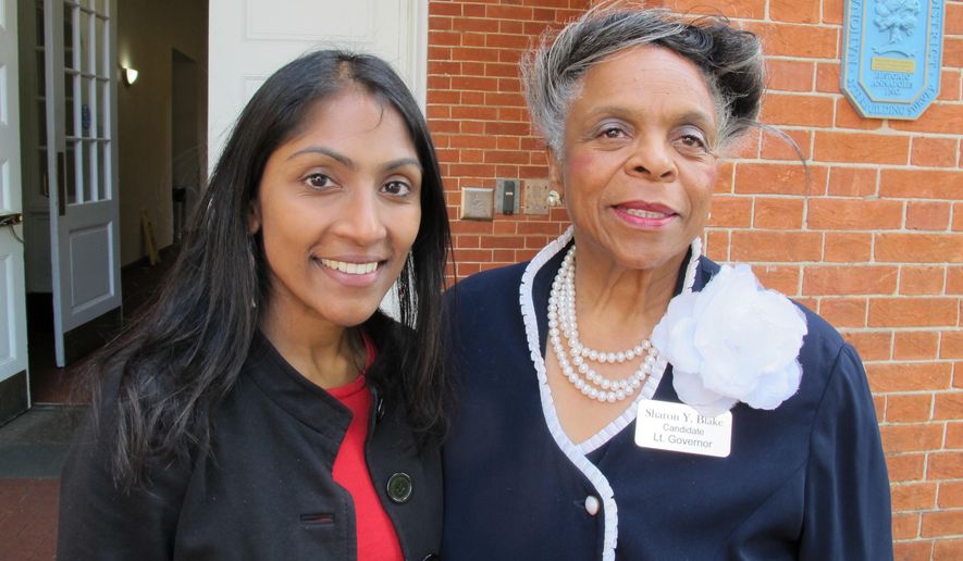 Krish Vignarajah, left, who is seeking the Democratic nomination for governor of Maryland, stands with her running mate, Sharon Blake, after a judge dismissed a case on Tuesday, June 12, 2018 in Annapolis, Md., that challenged Vignarajah's eligibility to run over residency requirements. Vignarajah said after the ruling she's excited to move beyond the case and focus on the issues of the campaign. (AP Photo/Brian Witte)