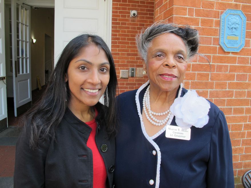 Krish Vignarajah, left, who is seeking the Democratic nomination for governor of Maryland, stands with her running mate, Sharon Blake, after a judge dismissed a case on Tuesday, June 12, 2018 in Annapolis, Md., that challenged Vignarajah's eligibility to run over residency requirements. Vignarajah said after the ruling she's excited to move beyond the case and focus on the issues of the campaign. (AP Photo/Brian Witte)