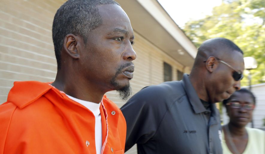 FILE - In a Sept. 16, 2016 file photo, Rodney Earl Sanders, of Kosciusko, Miss., says nothing as he leaves the Durant Municipal Building after a probable cause hearing in municipal court, in Durant, Miss. District Attorney Akillie Malone-Oliver tells The Associated Press on Tuesday, June 12, 2018 that Sanders, charged with killing two nuns in 2016, will plead guilty as part of an agreement that removes the possibility of the death penalty. (AP Photo/Rogelio V. Solis, File)