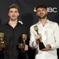FILE - In this May 20, 2018, file photo, Andrew Taggart, left, and Alex Pall of &amp;quot;The Chainsmokers&amp;quot; pose in the press room with the awards for top dance/electronic artist, top dance/electronic song for &amp;quot;Something Just Like This&amp;quot; and top dance/electronic album &amp;quot;Memories…Do Not Open&amp;quot; at the Billboard Music Awards at the MGM Grand Garden Arena in Las Vegas. The Chainsmokers is looking to mesh their EDM-style with some of the most popular songs from Michael Jackson to Beyonce during one-night only performance in July. Tickets for the event go on sale on Wednesday, June 13. (Photo by Jordan Strauss/Invision/AP, File)