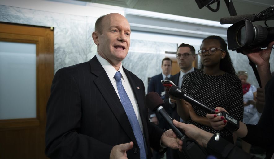 Sen. Chris Coons, D-Del., a member of the Senate Foreign Relations Committee and the Judiciary Committee, responds to reporters on Capitol Hill in Washington, Tuesday, June 12, 2018. (AP Photo/J. Scott Applewhite) ** FILE **