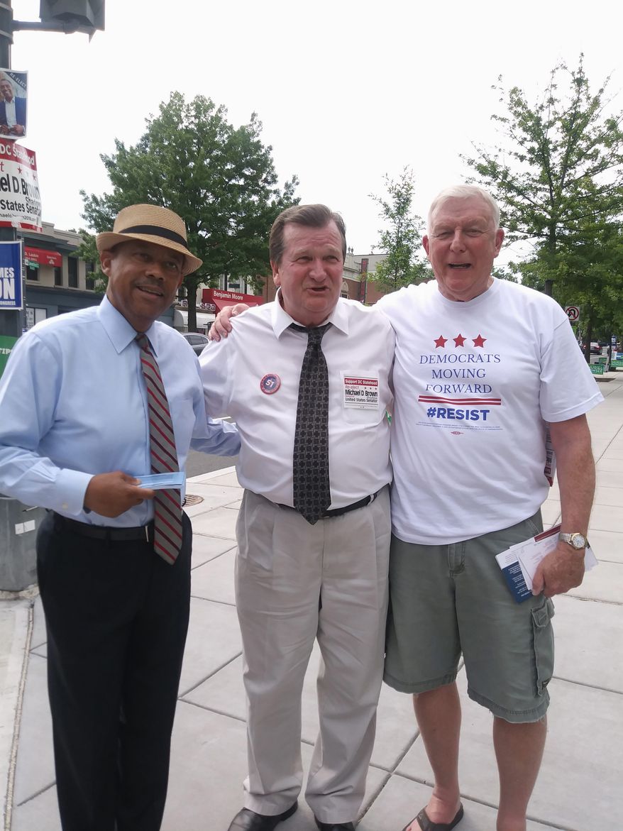 L-R: Virgil J. Young (James Butler campaign aide), D.C. "shadow" senator Michael D. Brown and Dave Donaldson (at-large committeeman for Democratic State Committee candidate) enticing D.C. residents to cast early votes at the Chevy Chase Community Center. June 8, 2018 (Jada Butler/The Washington Times)