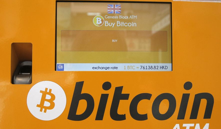 This May 11, 2018, file photo shows a bitcoin ATM in Hong Kong. (AP Photo/Kin Cheung, File)