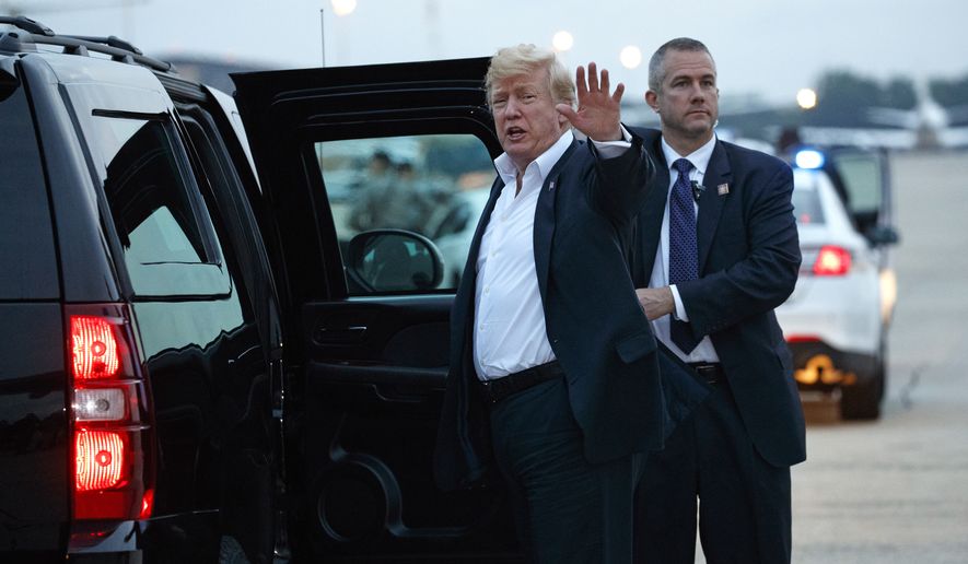 U.S. President Donald Trump yells to reporters after arriving at Andrews Air Force Base after a summit with North Korean leader Kim Jong-un in Singapore, Wednesday, June 13, 2018, in Andrews Air Force Base, Md. (AP Photo/Evan Vucci)