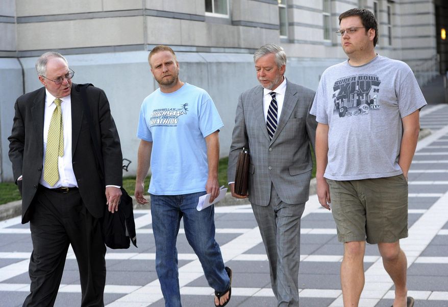 FILE - In this undated file photo, David Nicoll, center left, 39, of Mountain Lakes, N.J., president of Biodiagnostic laboratory Services, and employee and brother Scott Nicoll, right, 32, of Wayne, N.J., leave Federal Court in Newark, N.J., with representatives after being arrested in 2013 and pleaded guilty to conspiracy and money laundering through their New Jersey company. The brothers are scheduled to appear before a federal judge in Newark, facing sentencing on Wednesday, June 13, 2018. (Tyson Trish/The Record via AP, File)