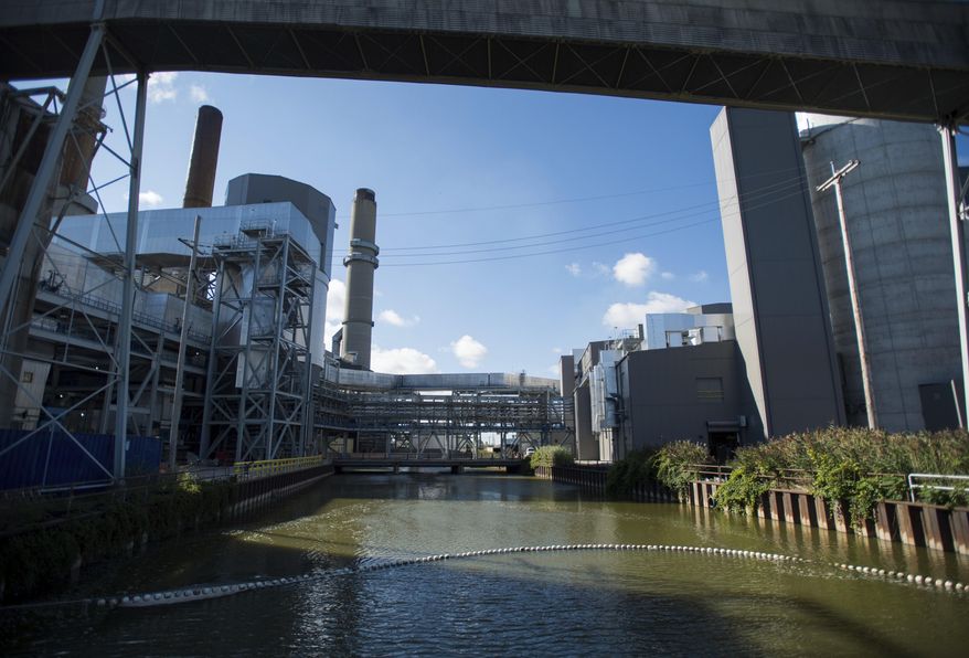 FILE - This Aug. 28, 2014 file photo shows, Karn coal-fired units 1 and 2 at Karn Generating Complex in Hampton Township, Mich. Consumers Energy says it will retire the two aging power units in 2023 as part of a long-term strategy to phase out coal and boost use of renewable power sources. (Yfat Yossifor /The Bay City Times via AP, File)